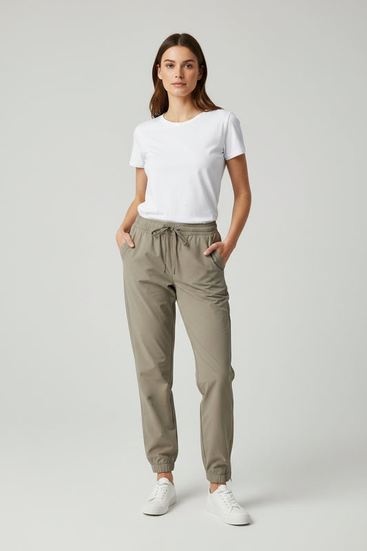 Jogger Alo yoga rompe vientos beige
