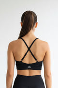 Top Alo yoga negro cruzado