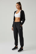 Jogger Alo yoga rompe vientos negro