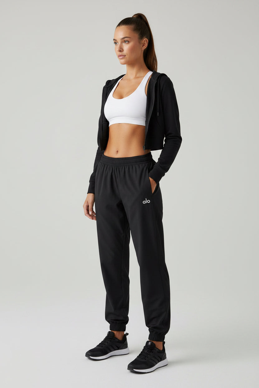 Jogger Alo yoga rompe vientos negro