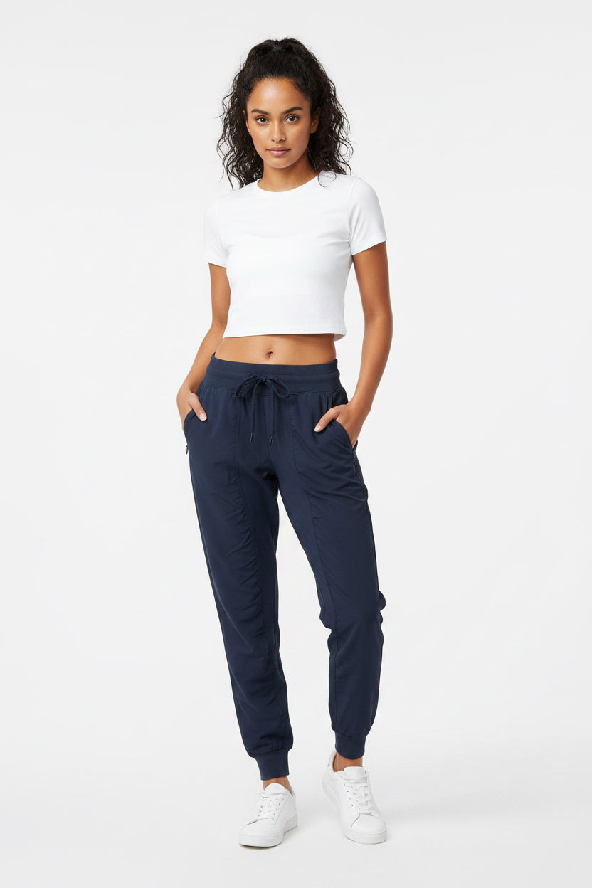 Jogger alo yoga rompe vientos azul marino