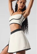 Conjunto Alo yoga falda beige