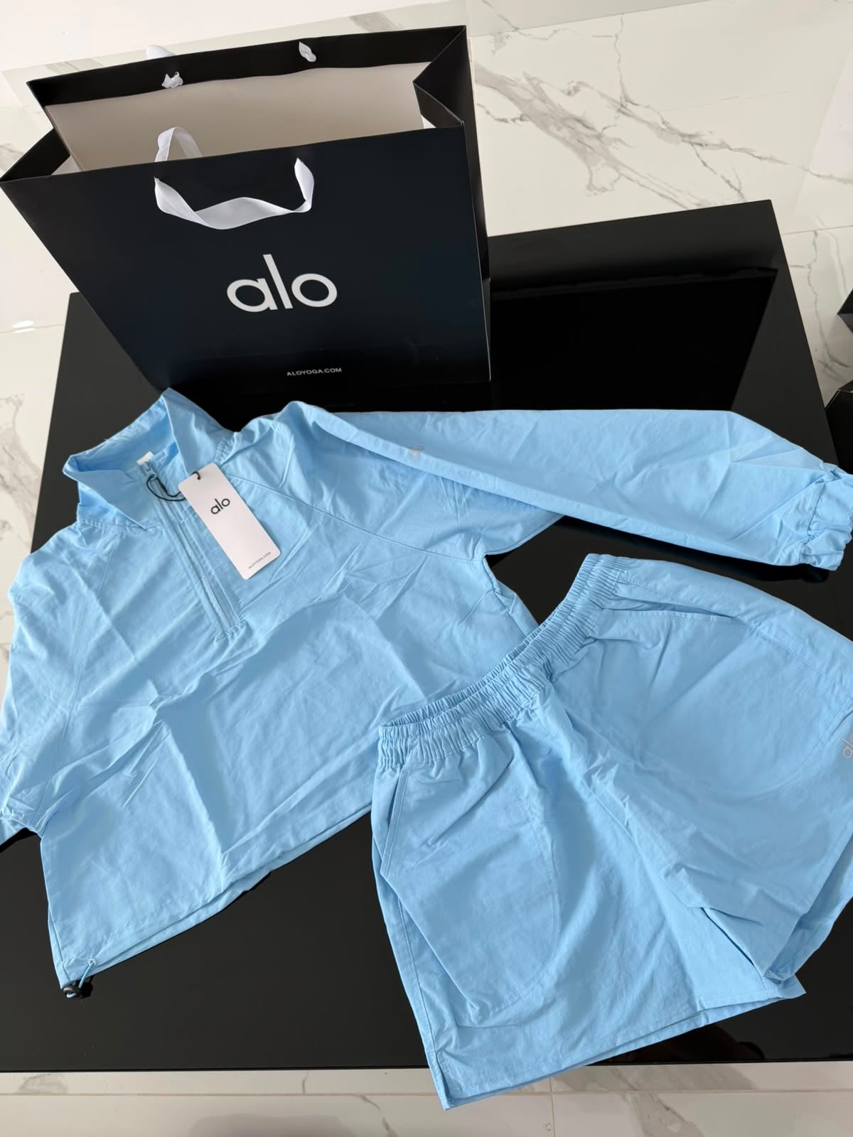 Conjunto Alo yoga rompe vientos azul